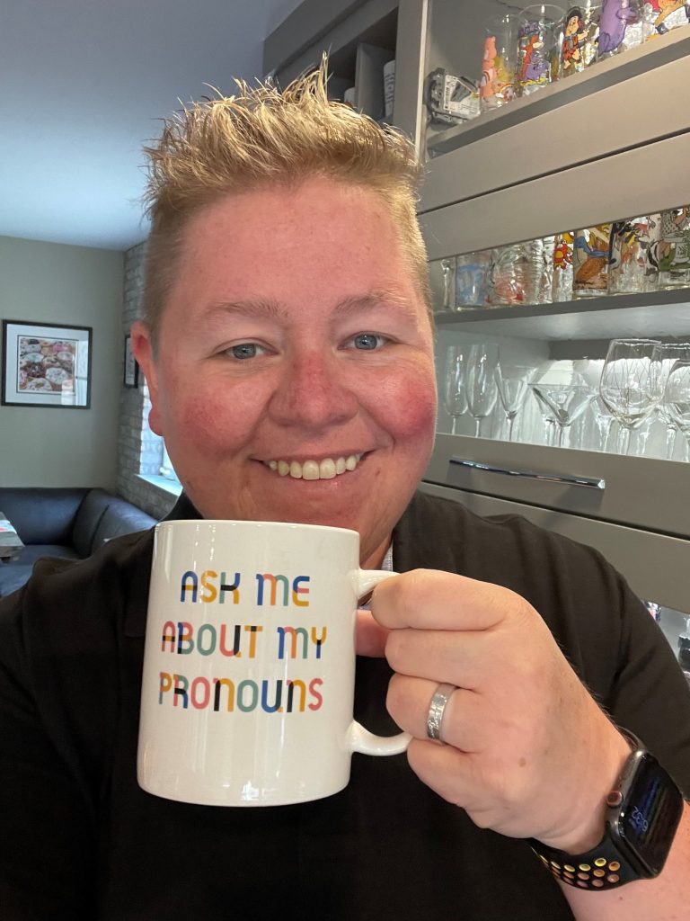 Shawn H. holding mug