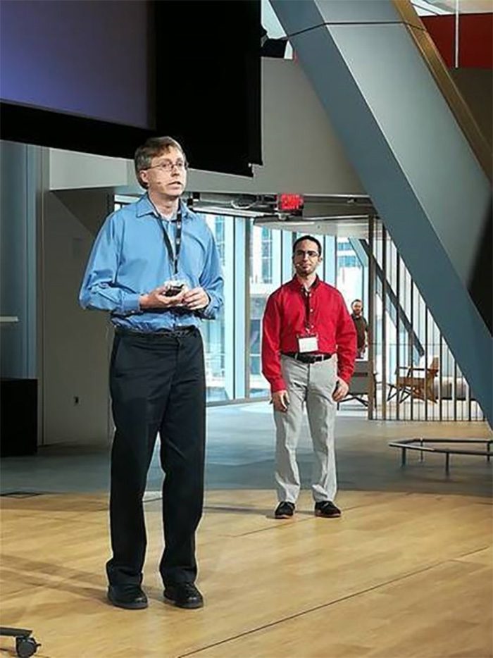 Jeff F. and colleague presenting at a conference.