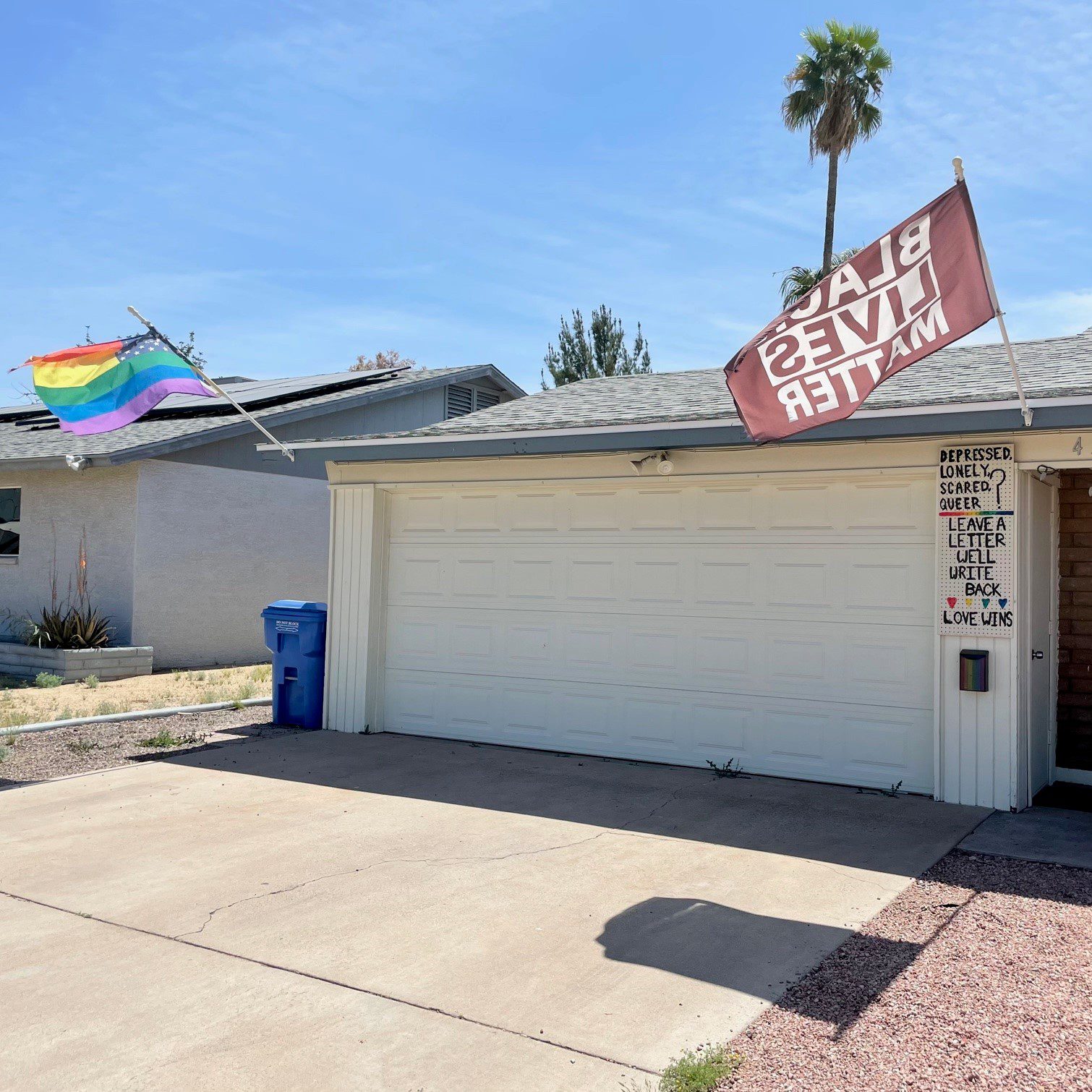 Pride Flag and Black Lives Matter Flag in front of home