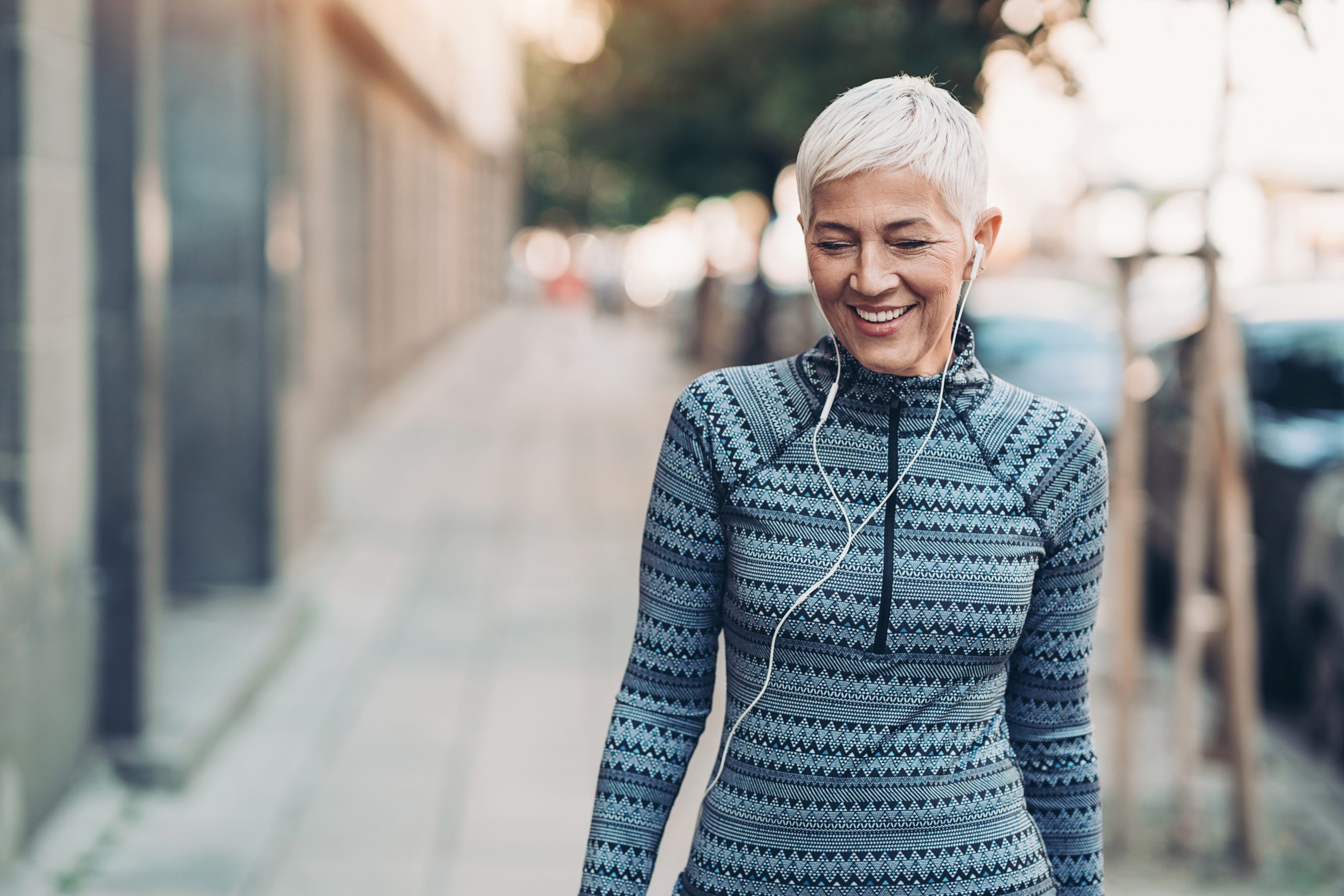 woman outside in active wear with headphones