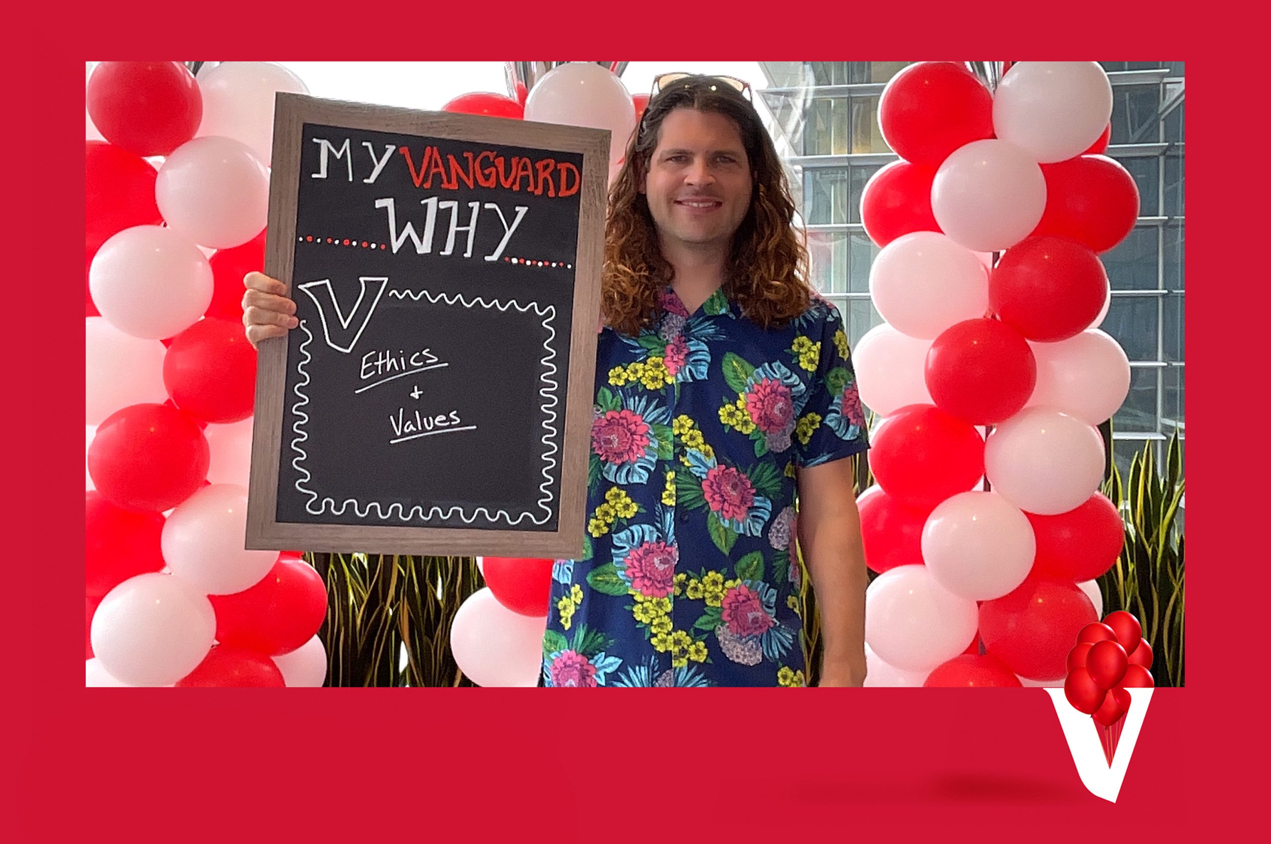 Patrick L. holding My Vanguard Why sign