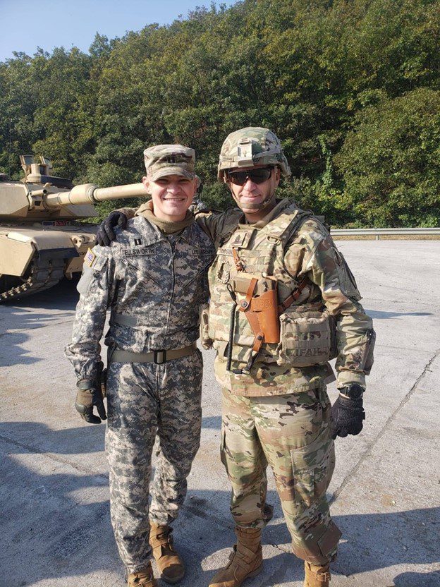Sean E. in uniform with colleague in uniform