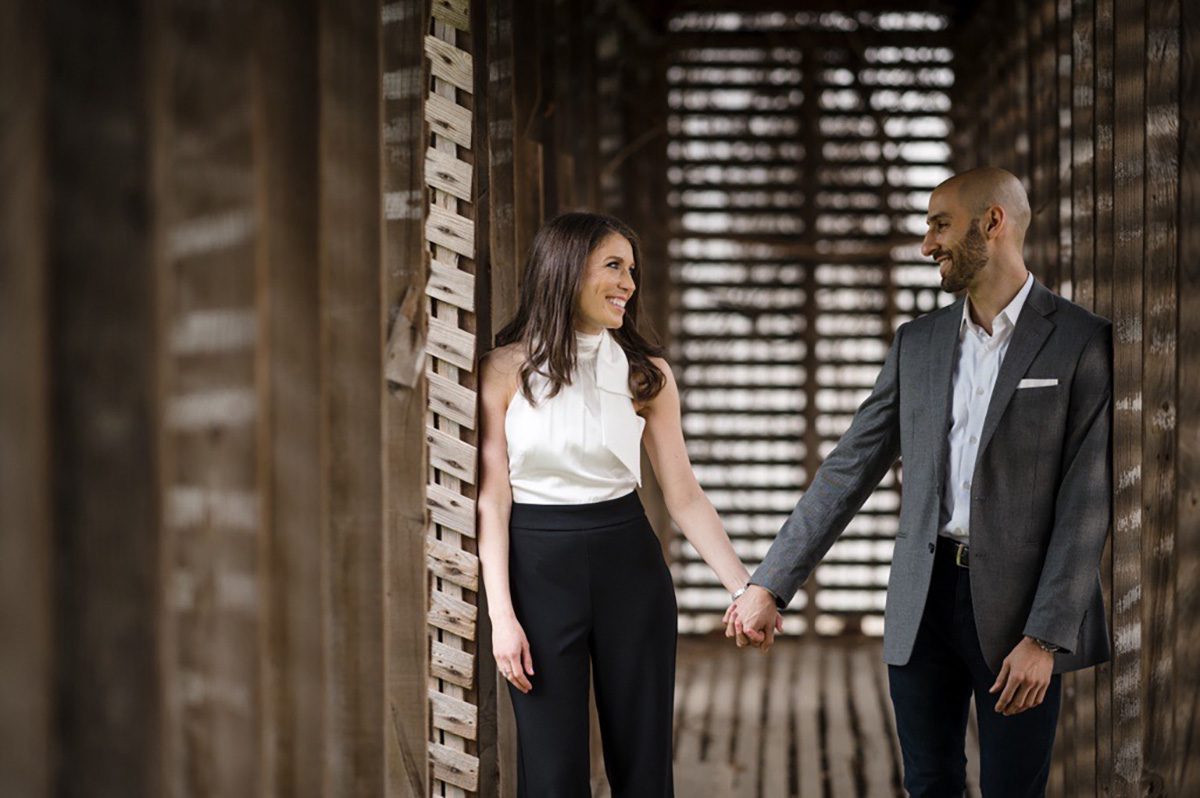 Jonathan P. holding hands with wife