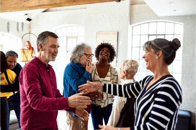 c11n fixed aspect ratio spacer (2) Diverse group of older adults, celebrating and embracing.
