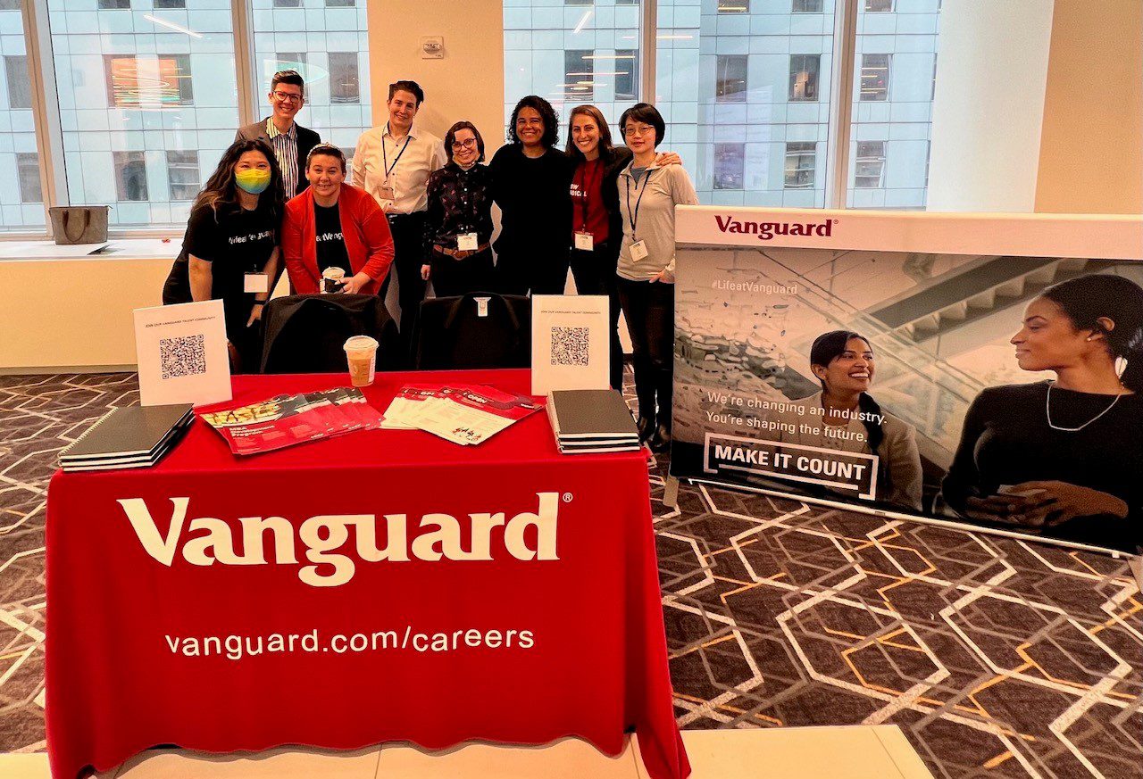 Vanguard crew gathered at recruiting booth at Out Women in Business event