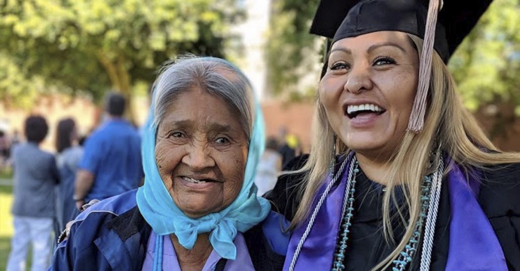 Fedora H. with grandmother at graduation