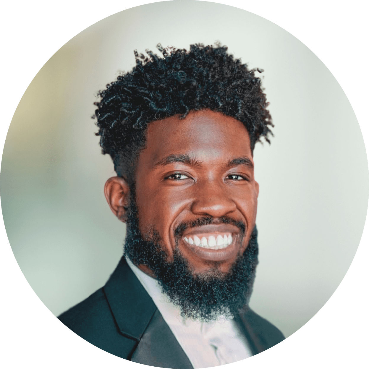 DaJuan L. looking at the camera, smiling.