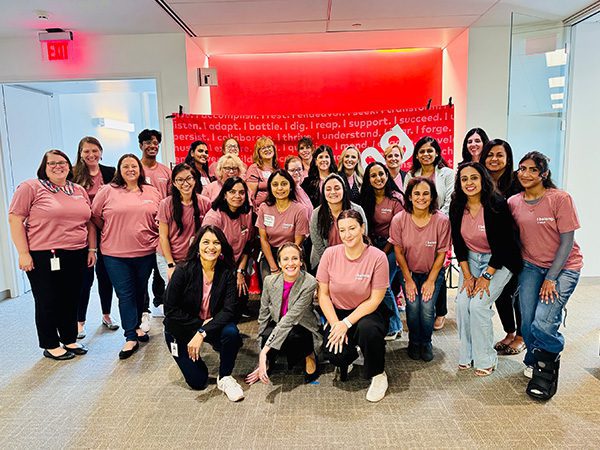 Group photo of Justina and fellow women in tech co-workers