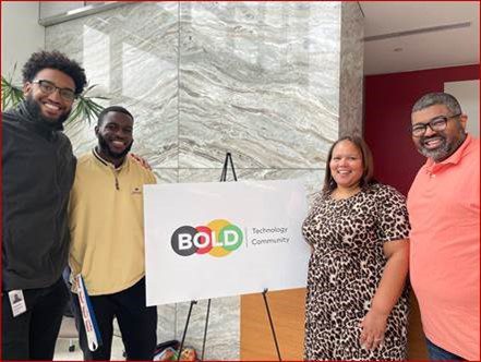 Quentin standing with fellow BOLD members in front of BOLD sign