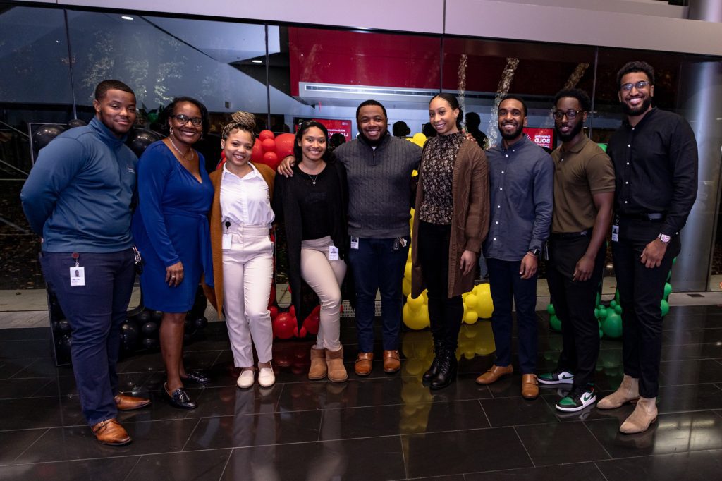 Quentin standing with other BOLD crew members